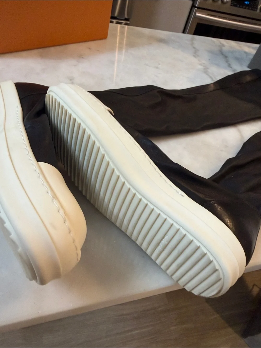 Rick Owens black knee-high boots with white platform sole